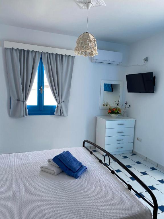 Postel nebo postele na pokoji v ubytování GIAVASI SEASIDE FINIKI