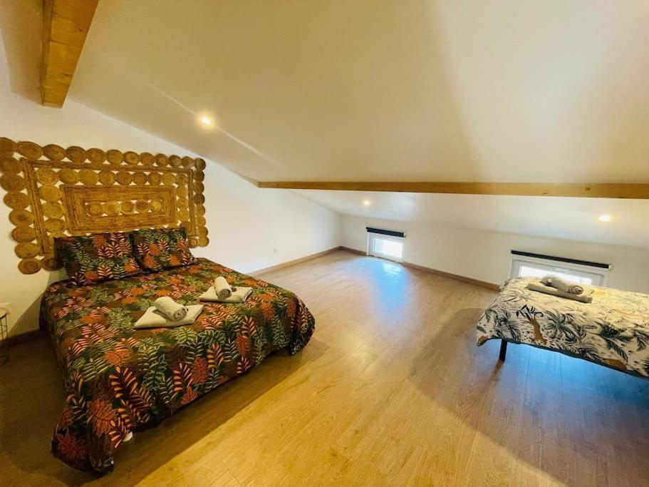 Postel nebo postele na pokoji v ubytování L’orchidée