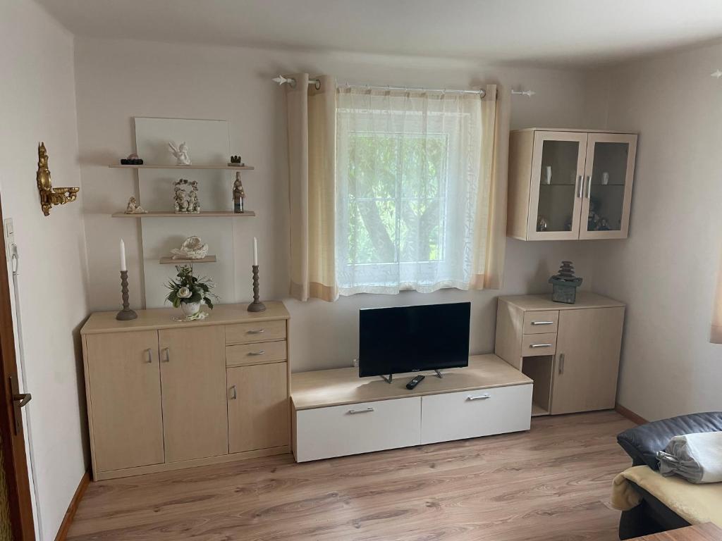 TV a/nebo společenská místnost v ubytování Ferienhaus Pogatschnig