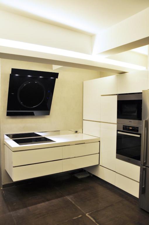 Kuchyň nebo kuchyňský kout v ubytování Biophilia Luxury Lofts