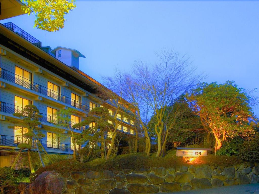 a building with its lights on in front of it at Shuzenji Onsen Katsuragawa in Izu