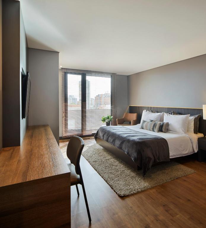 Postel nebo postele na pokoji v ubytování Nico Apartasuites