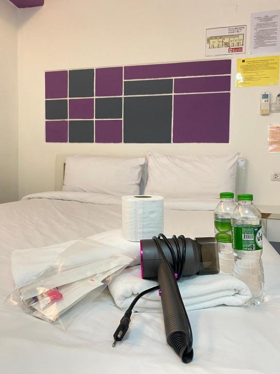 Postel nebo postele na pokoji v ubytování PDA Lord Hotel