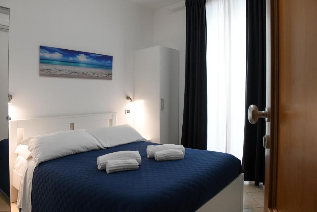 Posteľ alebo postele v izbe v ubytovaní DOMO ALGHERO CENTRO
