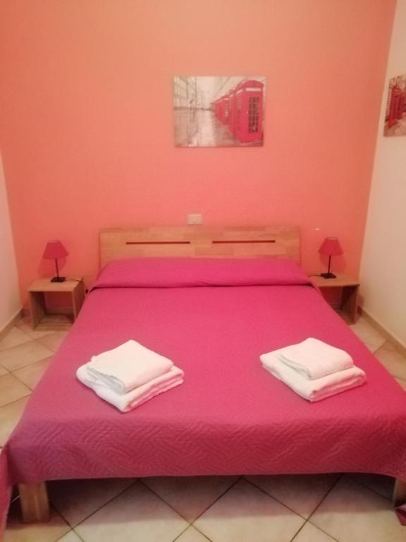 Postel nebo postele na pokoji v ubytování B&B Bella Calasetta
