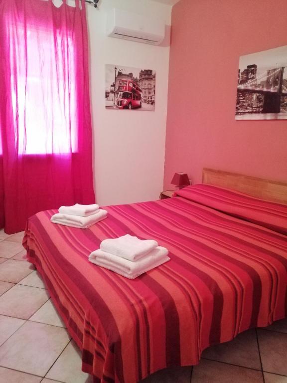 Postel nebo postele na pokoji v ubytování B&B Bella Calasetta