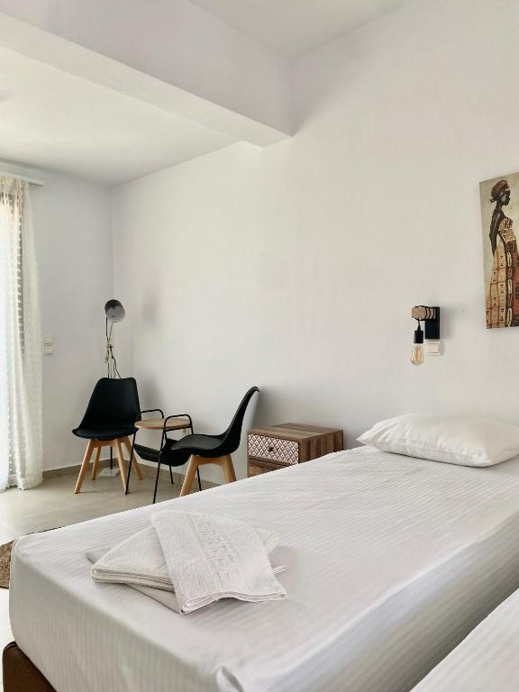 Postel nebo postele na pokoji v ubytování Fikas Hotel