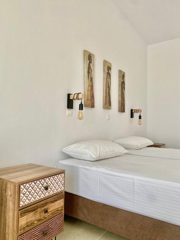 Postel nebo postele na pokoji v ubytování Fikas Hotel