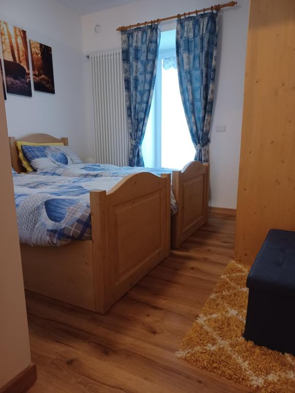 Postel nebo postele na pokoji v ubytování Appartamento Valmaor