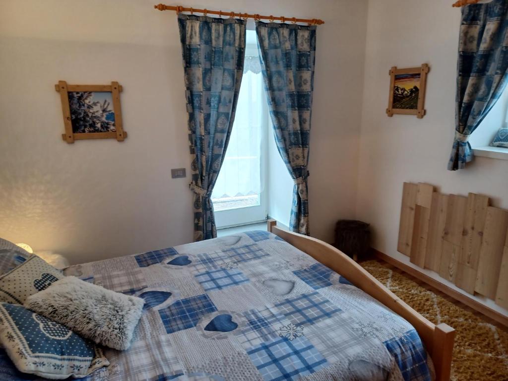 Postel nebo postele na pokoji v ubytování Appartamento Valmaor