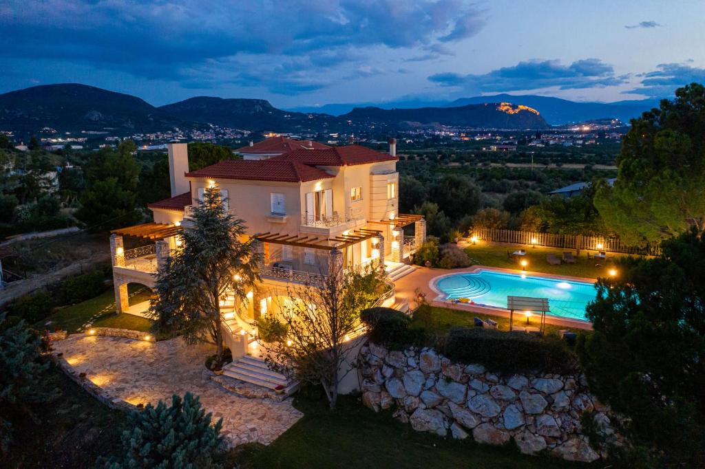 an aerial view of a house with a swimming pool at Villa San Adriano in Nafplio