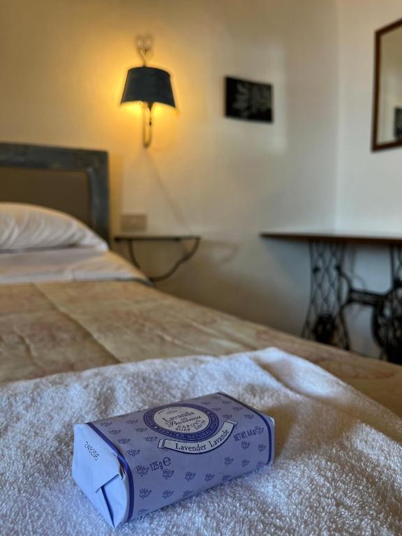 Postel nebo postele na pokoji v ubytování La Taberna di Rocca Calascio