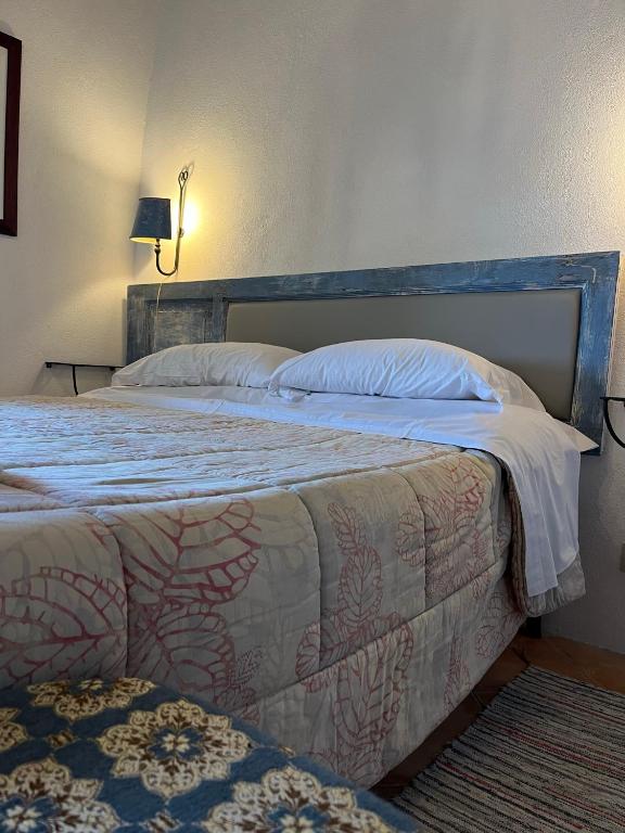 Postel nebo postele na pokoji v ubytování La Taberna di Rocca Calascio