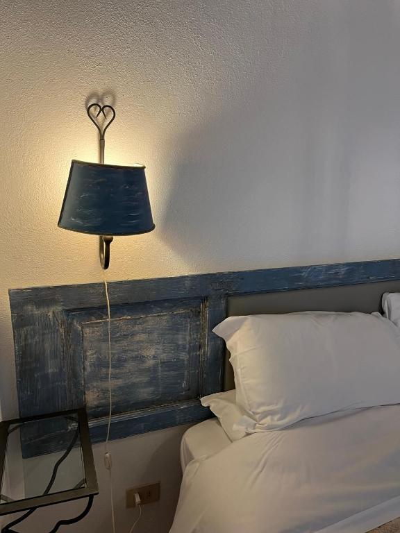 Postel nebo postele na pokoji v ubytování La Taberna di Rocca Calascio