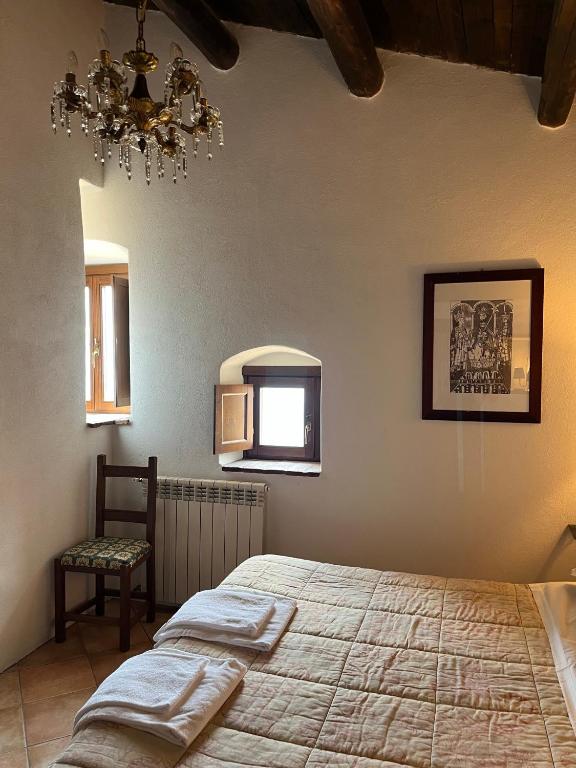 Postel nebo postele na pokoji v ubytování La Taberna di Rocca Calascio
