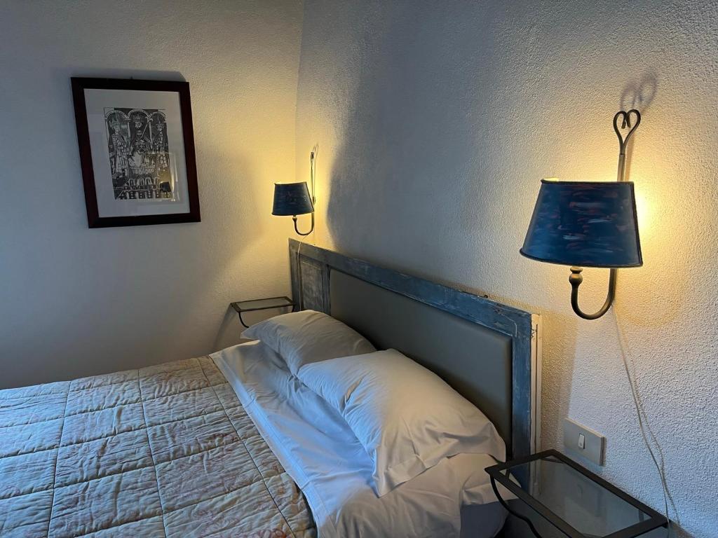 Postel nebo postele na pokoji v ubytování La Taberna di Rocca Calascio