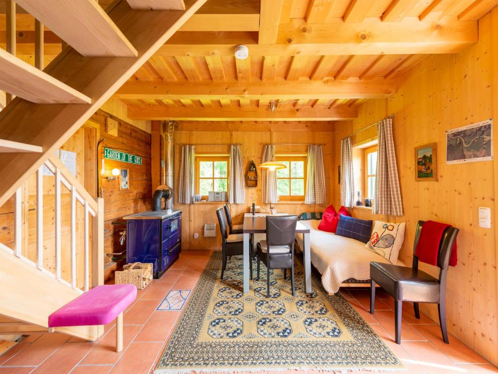 a living room with a couch and a table at Berghütte - Chalet für 4-6 Personen - Schwarzenberg am Böhmerwald in Schwarzenberg am Bohmerwald