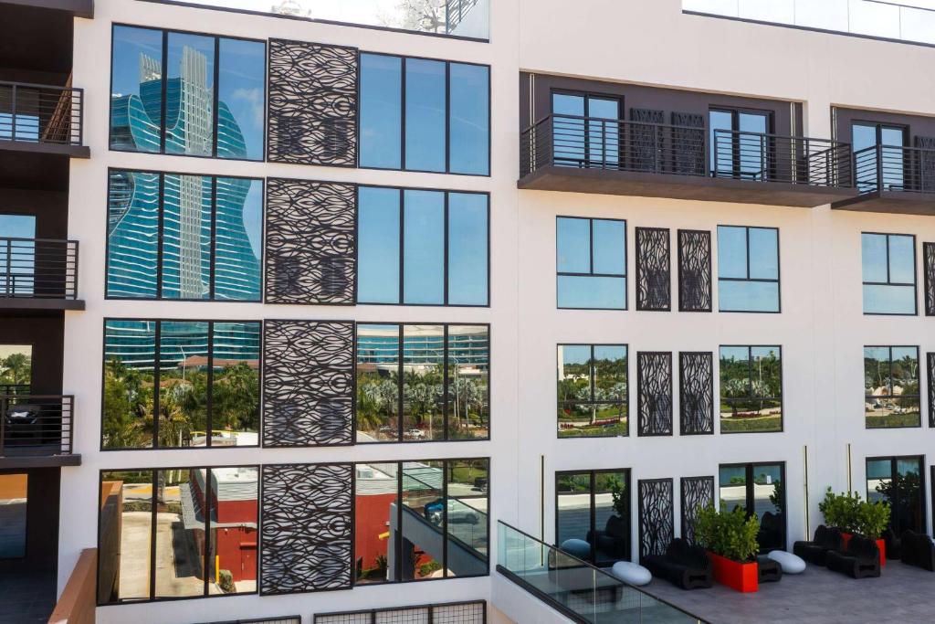 an apartment building with a lot of windows at Dolce by Wyndham Hollywood in Hollywood