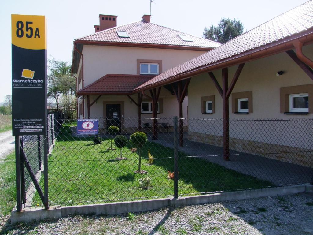 a fence in front of a house at Pokoje Gościnne in Rzeszów