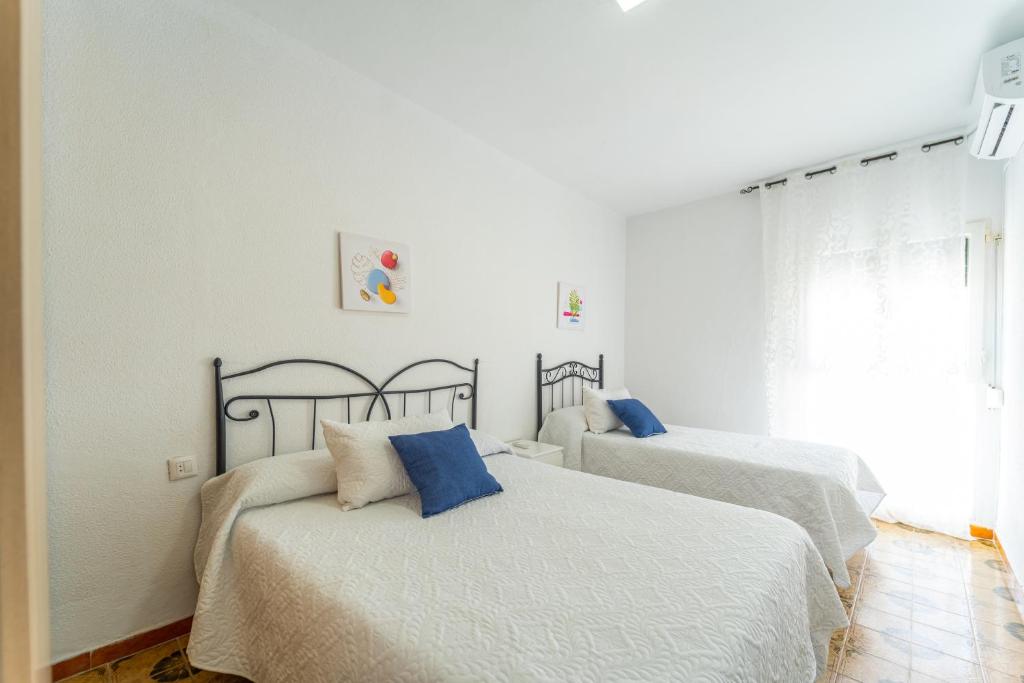 Postel nebo postele na pokoji v ubytování Apartamento Estudio Acuario Frente Mar