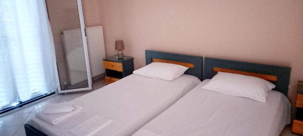 Postel nebo postele na pokoji v ubytování SPIROS HOME