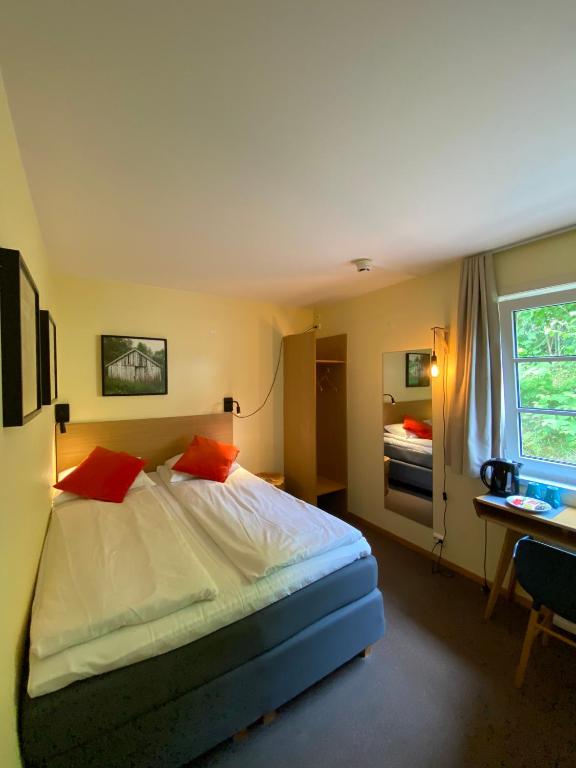 Postel nebo postele na pokoji v ubytování Lilland Brewery Hotel