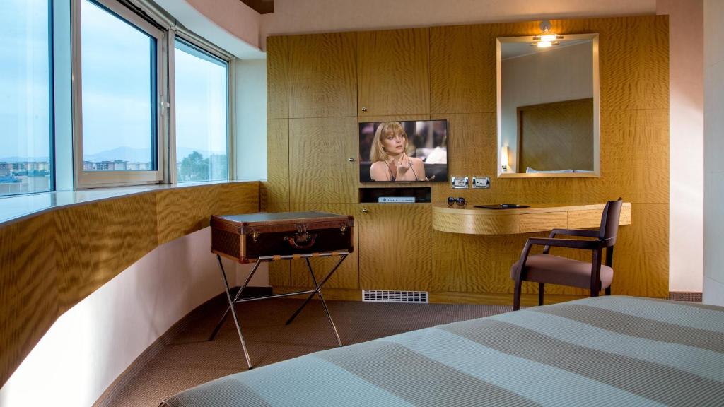 Posteľ alebo postele v izbe v ubytovaní Enea Hotel Aprilia