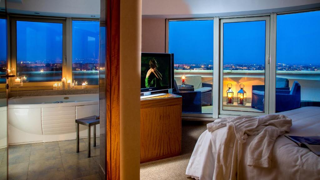 Posteľ alebo postele v izbe v ubytovaní Enea Hotel Aprilia