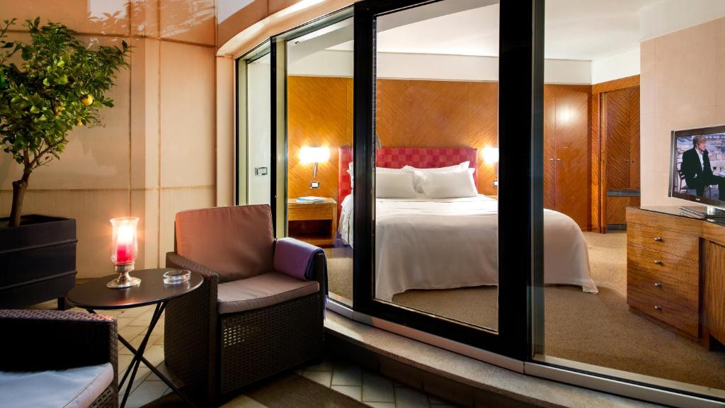 Posteľ alebo postele v izbe v ubytovaní Enea Hotel Aprilia