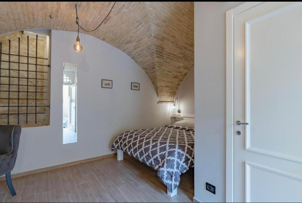 a bedroom with a bed in a room at Al Miracolo in Lanciano