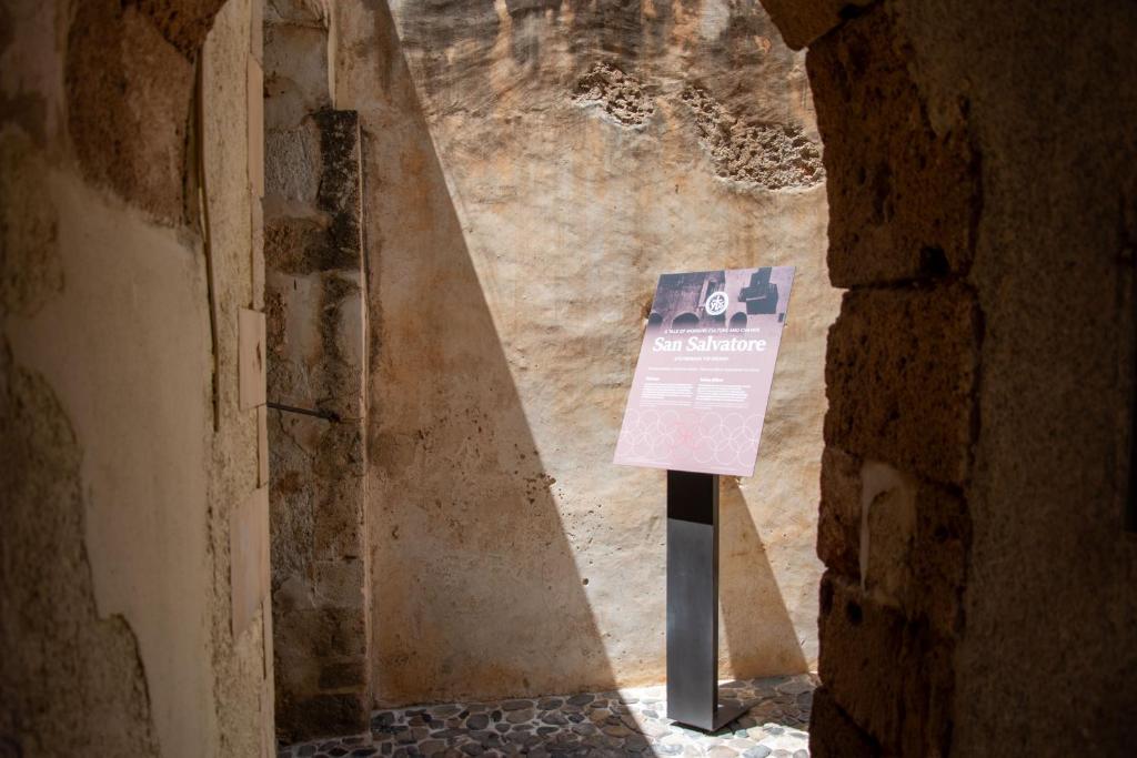 a sign in the middle of a room at San Salvatore Monastery in Chania