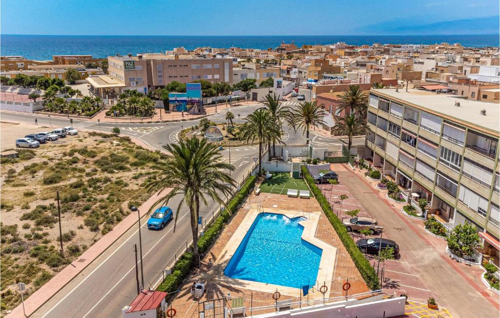 an aerial view of a city with a swimming pool at Beautiful Apartment In Cabo De Gata With 2 Bedrooms And Outdoor Swimming Pool in El Cabo de Gata