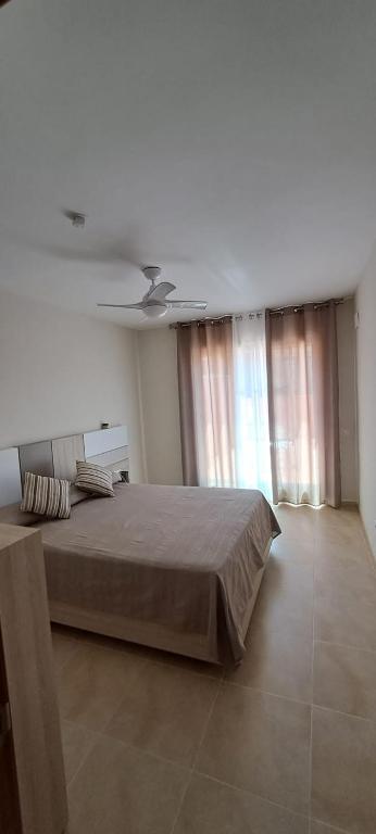 Postel nebo postele na pokoji v ubytování Lo Faro