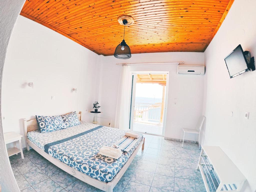 Postel nebo postele na pokoji v ubytování House Charistos