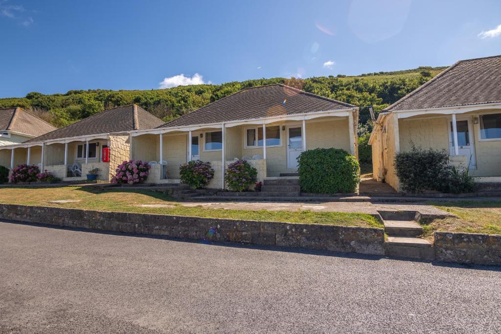 a row of houses on the side of a road at Kipling Villa With Sea Views in Bideford