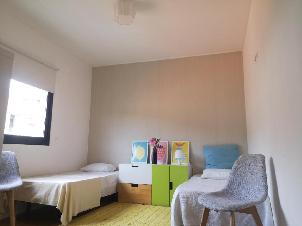 Postel nebo postele na pokoji v ubytování Green Apartment