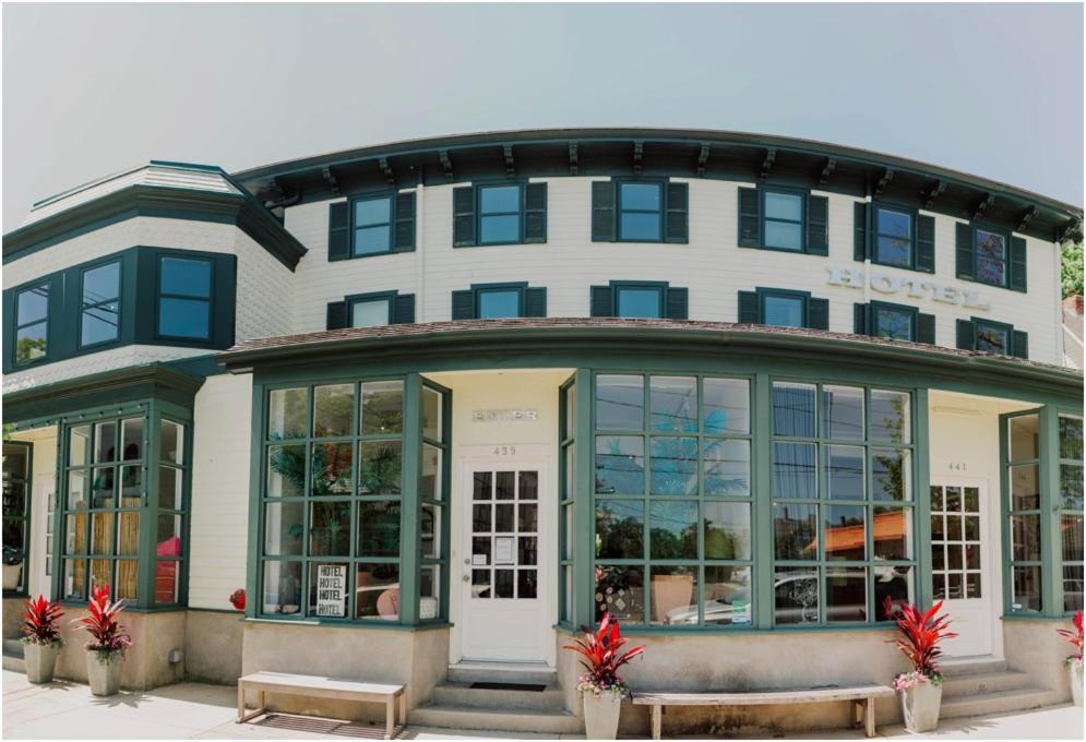 a building with a bench in front of it at ZEY HOTEL in Greenport