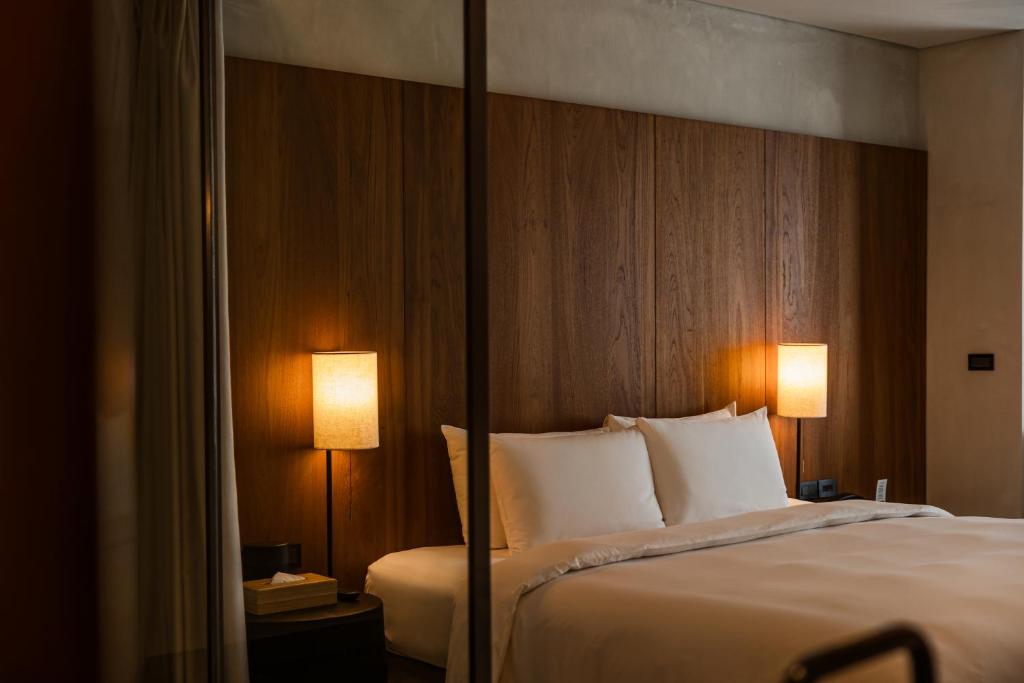 Postel nebo postele na pokoji v ubytování 了了礁溪 Vivir Jiaoxi Hotel