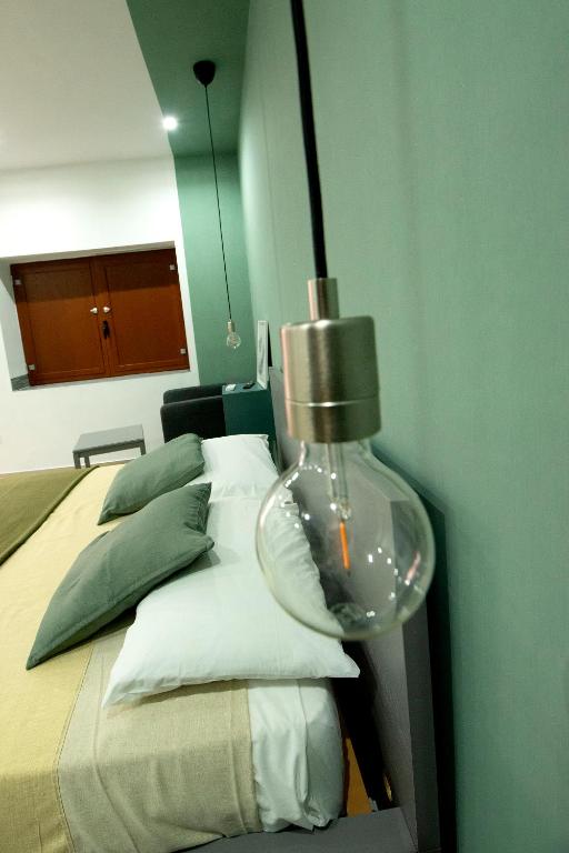 Postel nebo postele na pokoji v ubytování domus luì