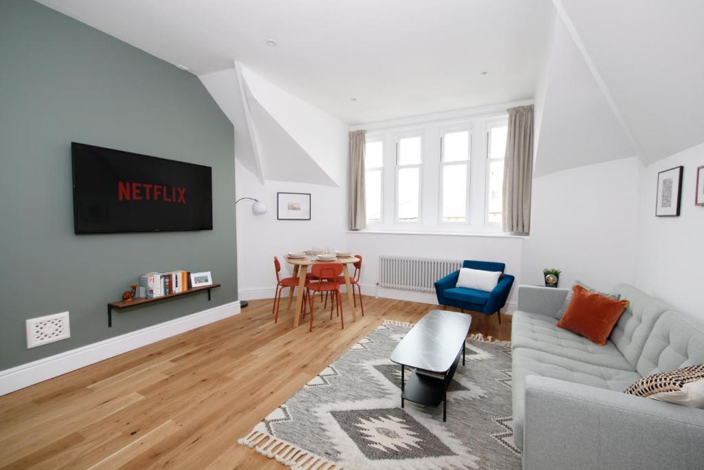 a living room with a couch and a table at The Artist's House in Scarborough