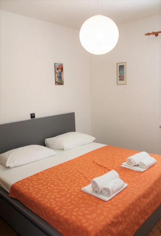 Postel nebo postele na pokoji v ubytování Apartments Ada