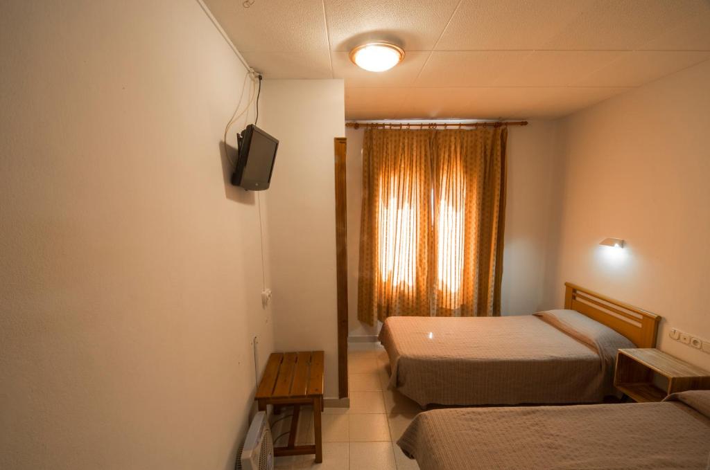 Postel nebo postele na pokoji v ubytování Turó de L´Home