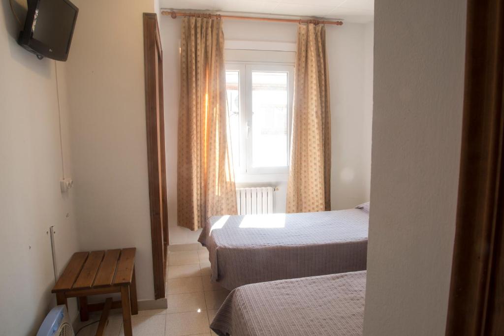 Postel nebo postele na pokoji v ubytování Turó de L´Home