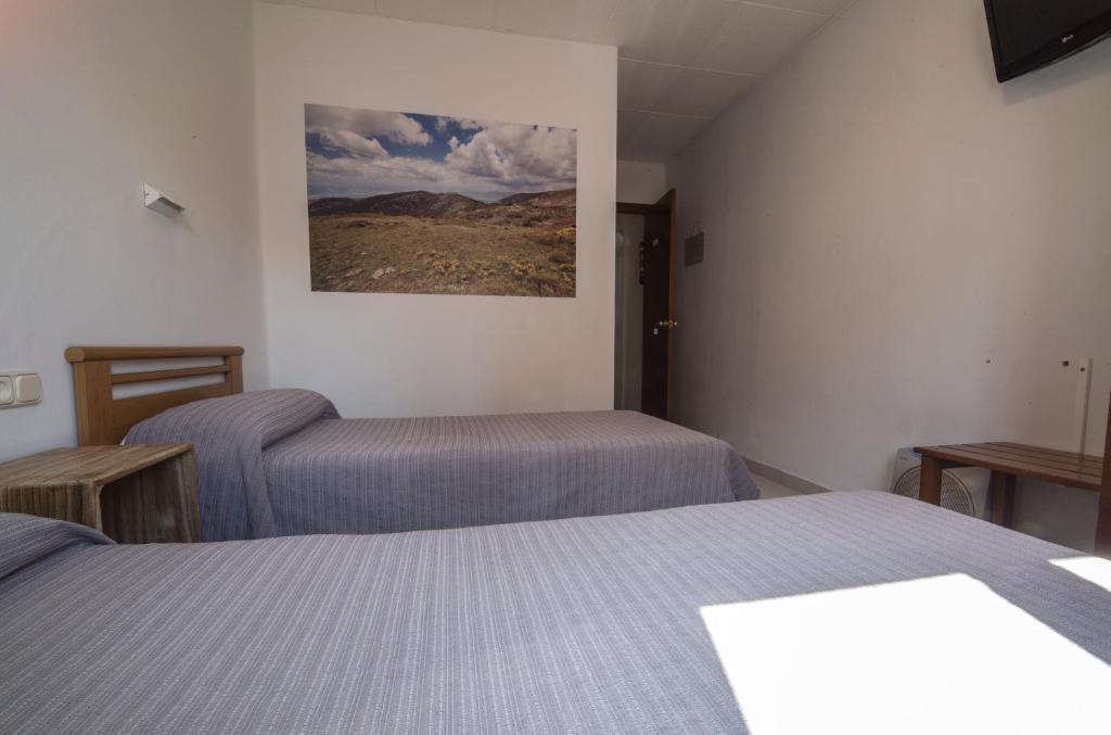 Postel nebo postele na pokoji v ubytování Turó de L´Home