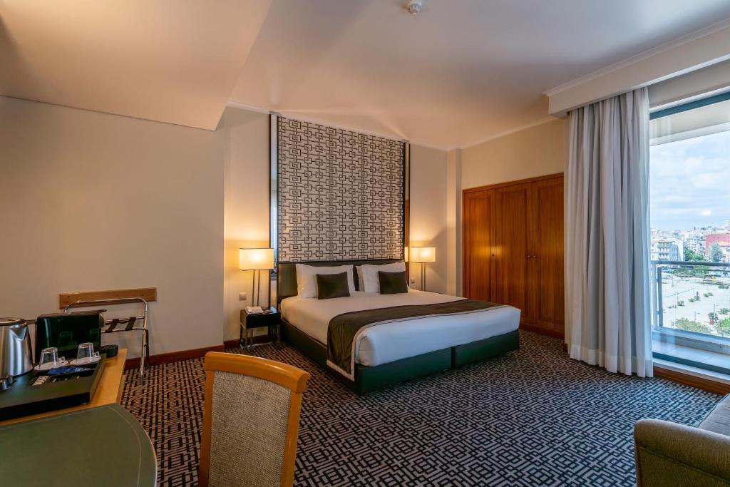 Ein Bett oder Betten in einem Zimmer der Unterkunft Hotel Mundial