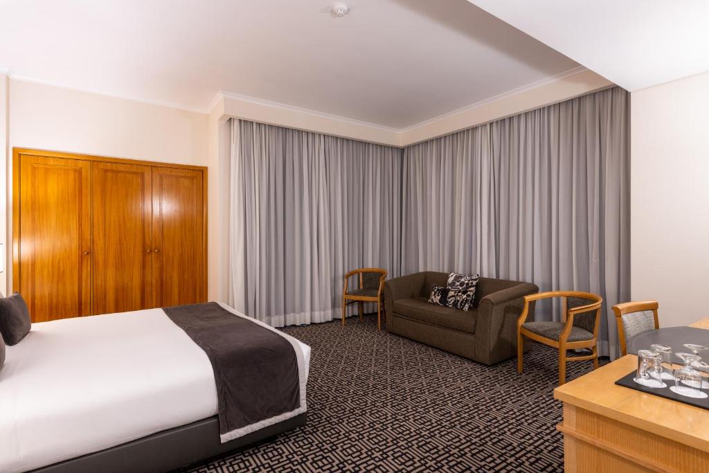 Ein Bett oder Betten in einem Zimmer der Unterkunft Hotel Mundial