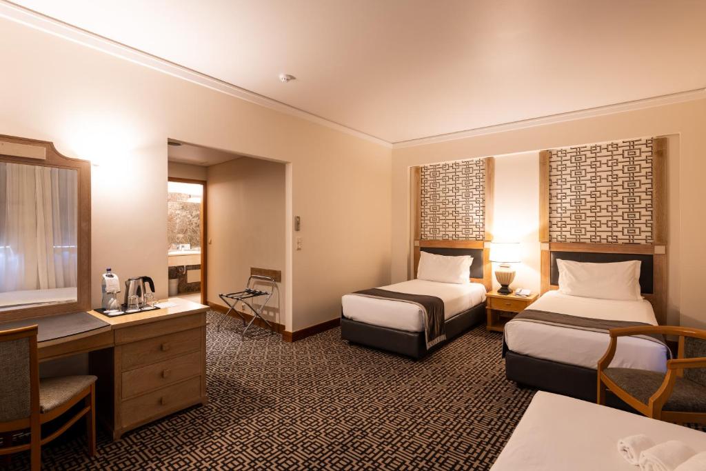 Ein Bett oder Betten in einem Zimmer der Unterkunft Hotel Mundial