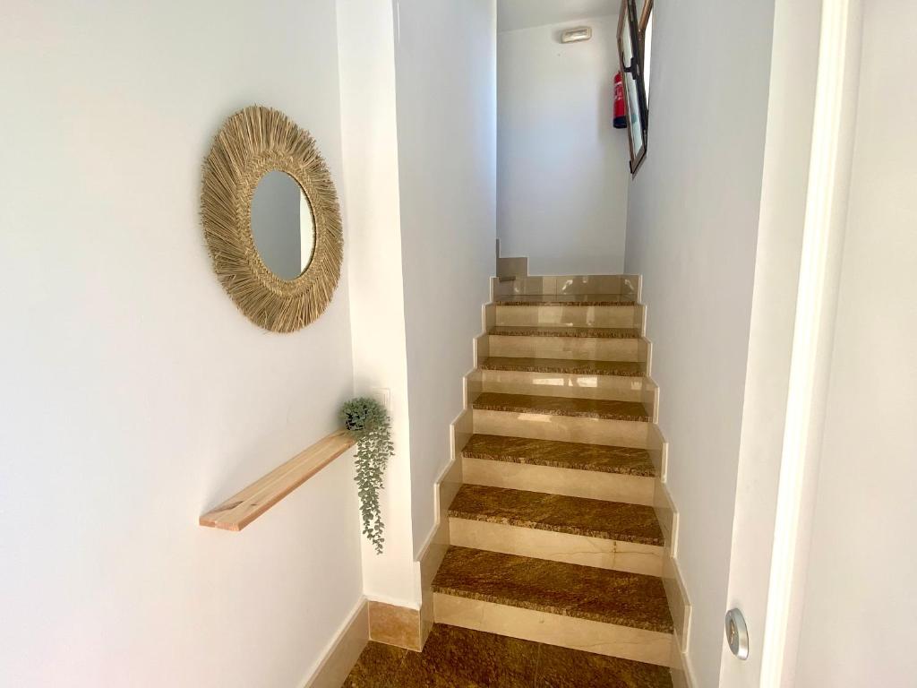 a stairway with a mirror and a mirror at La espiga de Segovia 2 in La Lastrilla