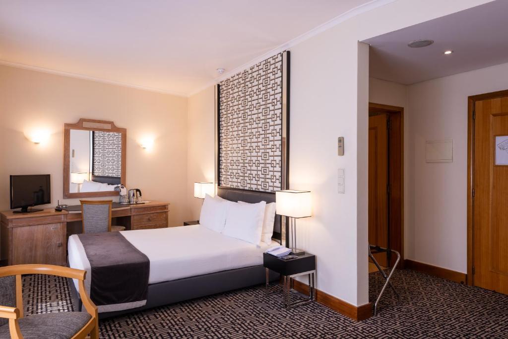 Ein Bett oder Betten in einem Zimmer der Unterkunft Hotel Mundial