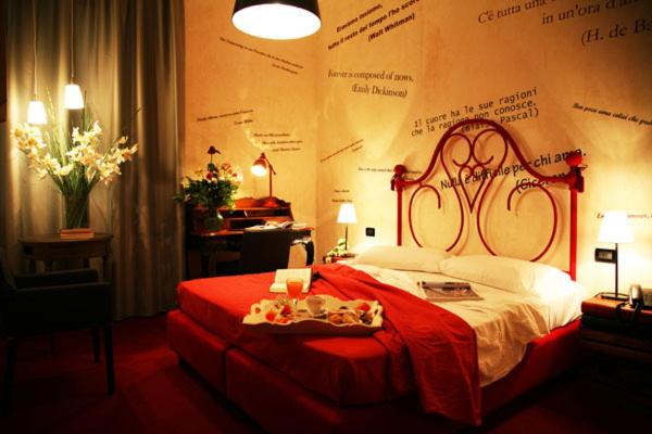Postel nebo postele na pokoji v ubytování Hotel Bella 'Mbriana